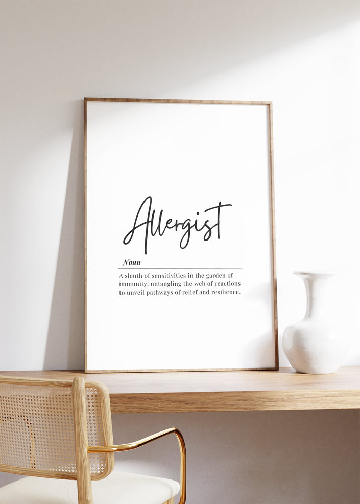 Framed minimalist print displaying 'Allergist' in stylish script with inspiring immunology definition on white background in light wooden frame